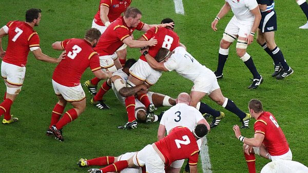 Welsh and English rugby players during a match